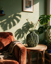 Lattice Bottle Vase – on a side table at golden hour