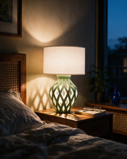 Lattice Bulb Table Lamp – at night on a bedside table