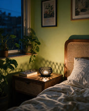 Lattice Tealight Holder – at night on a bedside table