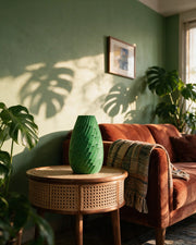 Leaf Scale Vase – on a side table at golden hour