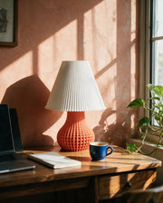 Mesh Bulb Table Lamp – on a work desk in morning sun