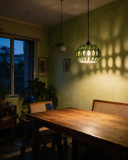Organic Lobe Pendant Light – at night on a bedside table