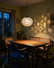 Oval Bubble Pendant Light – at night on a bedside table