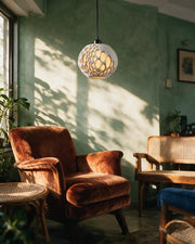 Oval Bubble Pendant Light – on a side table at golden hour