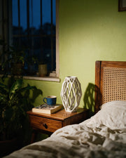Oval Cage Vase – at night on a bedside table