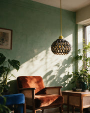 Oval Lattice Pendant Light – on a side table at golden hour