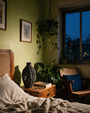 Oval Net Vase – at night on a bedside table