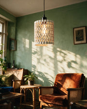 Oval Perf Pendant Light – on a side table at golden hour