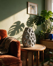 Oval Perf Vase – on a side table at golden hour