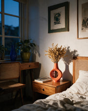 Oval Window Vase – at night on a bedside table