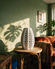 Perf Tower Vase – on a side table at golden hour