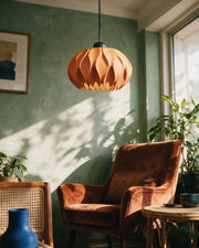 Petal Fold Pendant Light – on a side table at golden hour