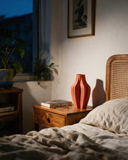 Petal Fold Vase – at night on a bedside table