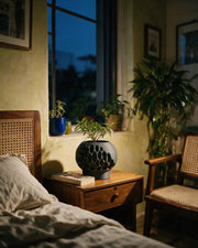 Pore Globe Planter – at night on a bedside table