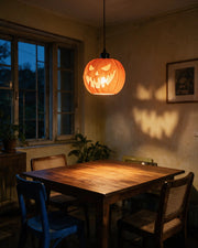 Pumpkin Lantern Pendant Light – at night on a bedside table