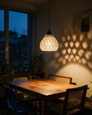 Quilt Bell Pendant Light – at night on a bedside table