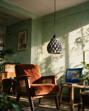Quilt Bell Pendant Light – on a side table at golden hour