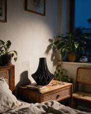 Radial Flare Vase – at night on a bedside table
