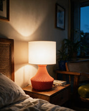 Radial Pleat Table Lamp – at night on a bedside table