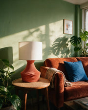 Radial Pleat Table Lamp – on a side table at golden hour