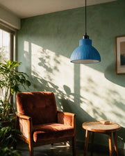 Rib Bell Pendant Light – on a side table at golden hour