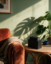 Rib Block Holder – on a side table at golden hour