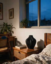 Rib Bulb Vase – at night on a bedside table