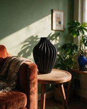 Rib Bulb Vase – on a side table at golden hour
