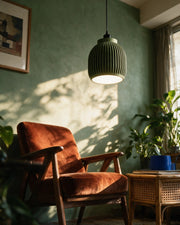 Rib Capsule Pendant Light – on a side table at golden hour