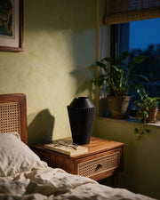 Rib Cone Vase – at night on a bedside table