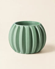 Rib Globe Planter – three-quarter studio view