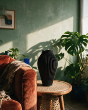 Rib Urn Vase – on a side table at golden hour