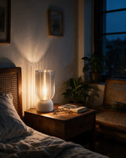 Ribbed Cylinder Table Lamp – at night on a bedside table