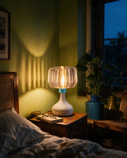 Ribbed Globe Table Lamp – at night on a bedside table
