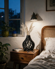 Ribbon Cage Vase – at night on a bedside table