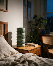 Ring Stack Vase – at night on a bedside table