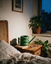 Ring Stack Watering Can – at night on a bedside table
