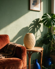 Scale Oval Vase – on a side table at golden hour