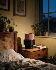Slat Pedestal Display Stand – at night on a bedside table