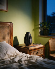 Slim Rib Vase – at night on a bedside table