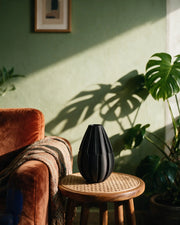 Slim Rib Vase – on a side table at golden hour