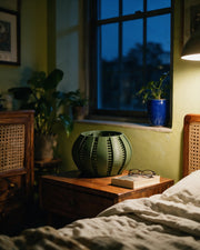 Slot Band Orchid Planter – at night on a bedside table