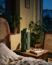 Slot Column Vase – at night on a bedside table