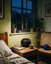 Slot Drum Orchid Planter – at night on a bedside table