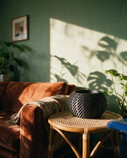 Slot Drum Orchid Planter – on a side table at golden hour