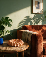 Small Coral Bowl – on a side table at golden hour