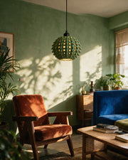 Spike Orb Pendant Light – on a side table at golden hour