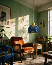 Spike Scale Pendant Light – on a side table at golden hour