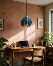 Spike Scale Pendant Light – on a work desk in morning sun