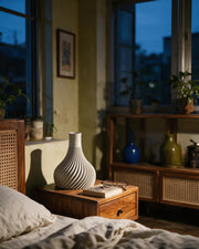 Spiral Fin Vase – at night on a bedside table
